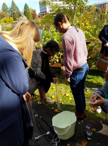 Educators learning to measure water transparency at the GLOBE-Eco-Schools USA workshop during the 2018 NAAEE conference.