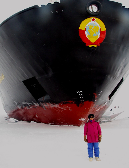Elena dwarfed by an Icebreaker. She had GLOBE workshop for teachers from Alaska, Canada, Russia, France, Great Britain,  during the Arctic Expedition for K-12 teachers on Icebreaker Kapitan Dranitsyn hosted by the International Arctic Research Center Nansen Amundsen Basins Observational System Expedition in Aug 2006.