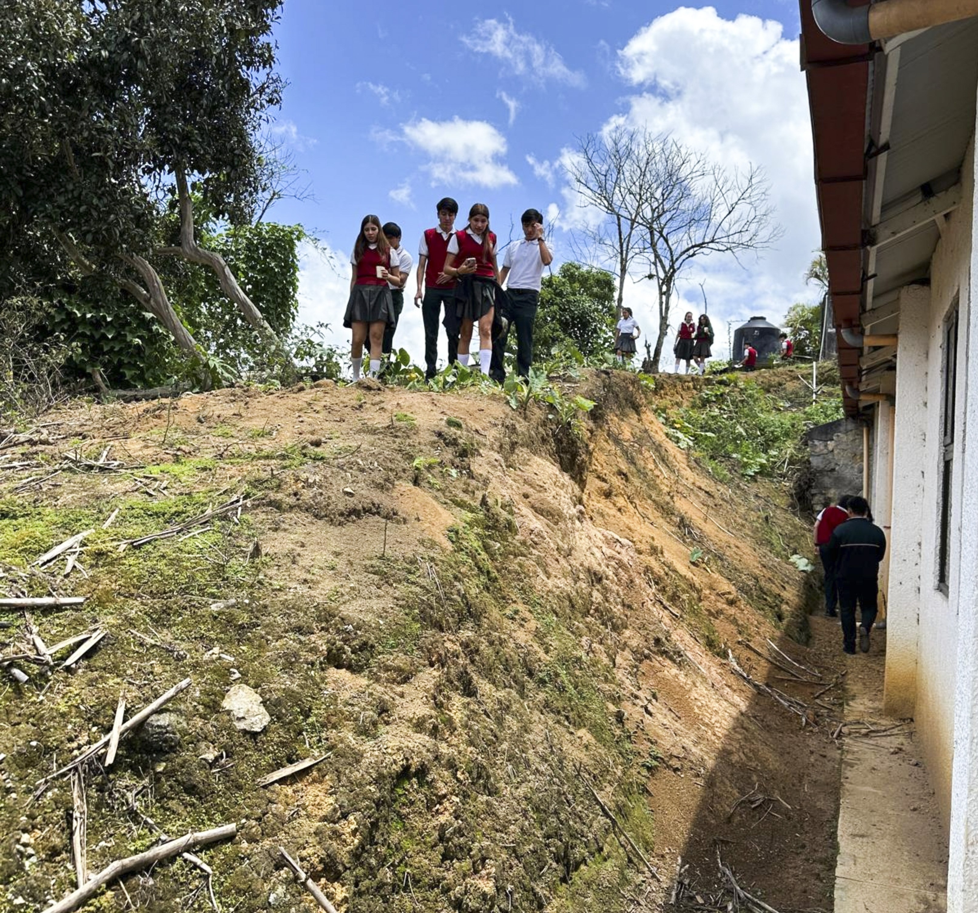 Students searching for mosquito habitats.
