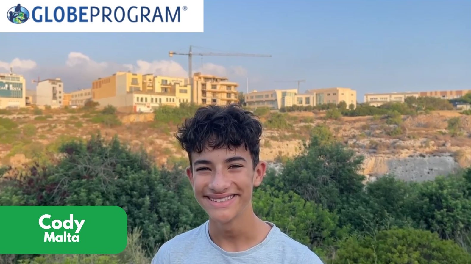 Student vlogger smiling.