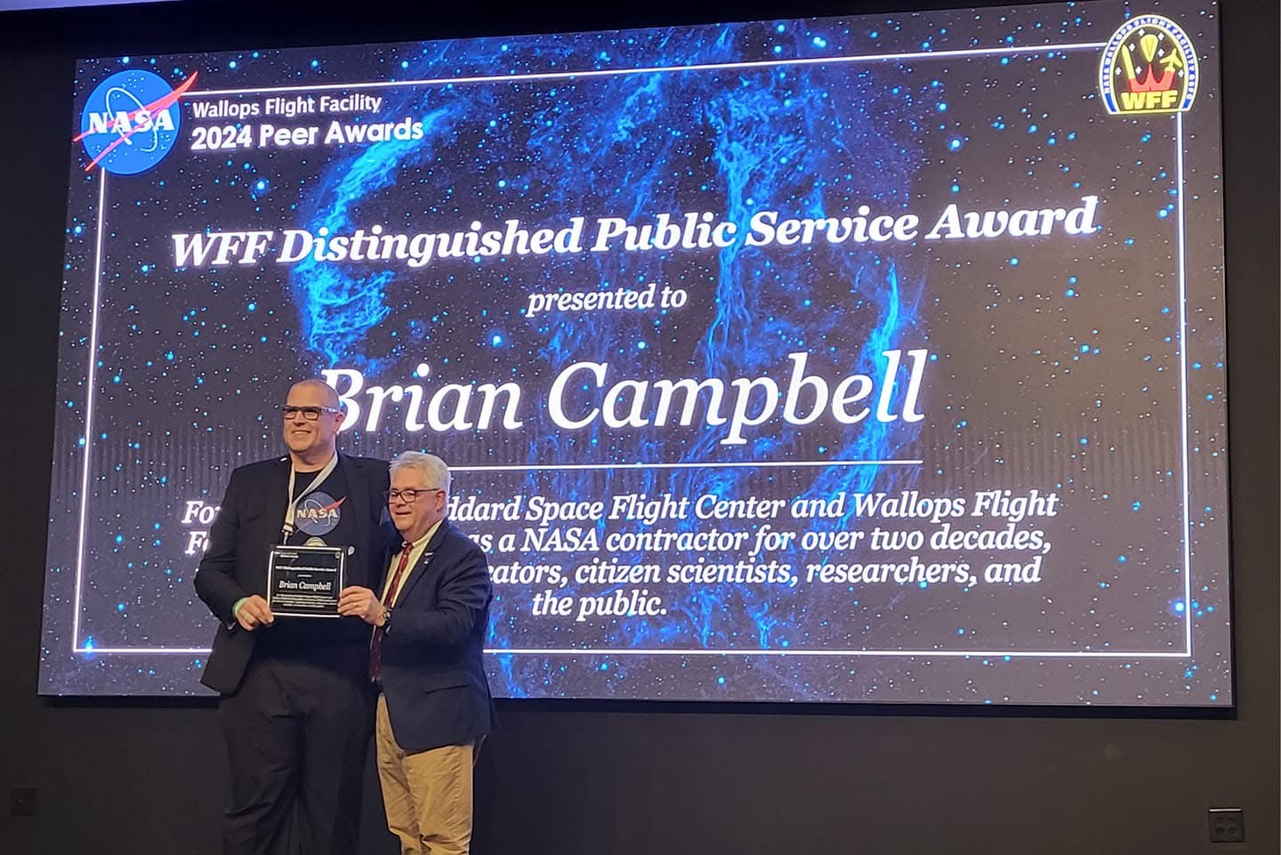 Brian Campbell accepting the 2024 NASA Wallops Distinguished Public Service Award for NASA contractors