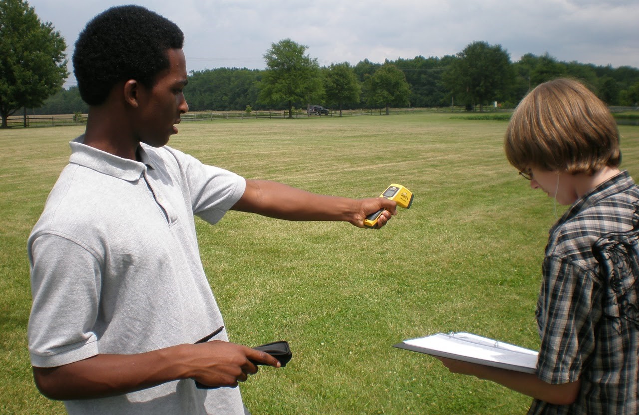 Students measuring surface temperature