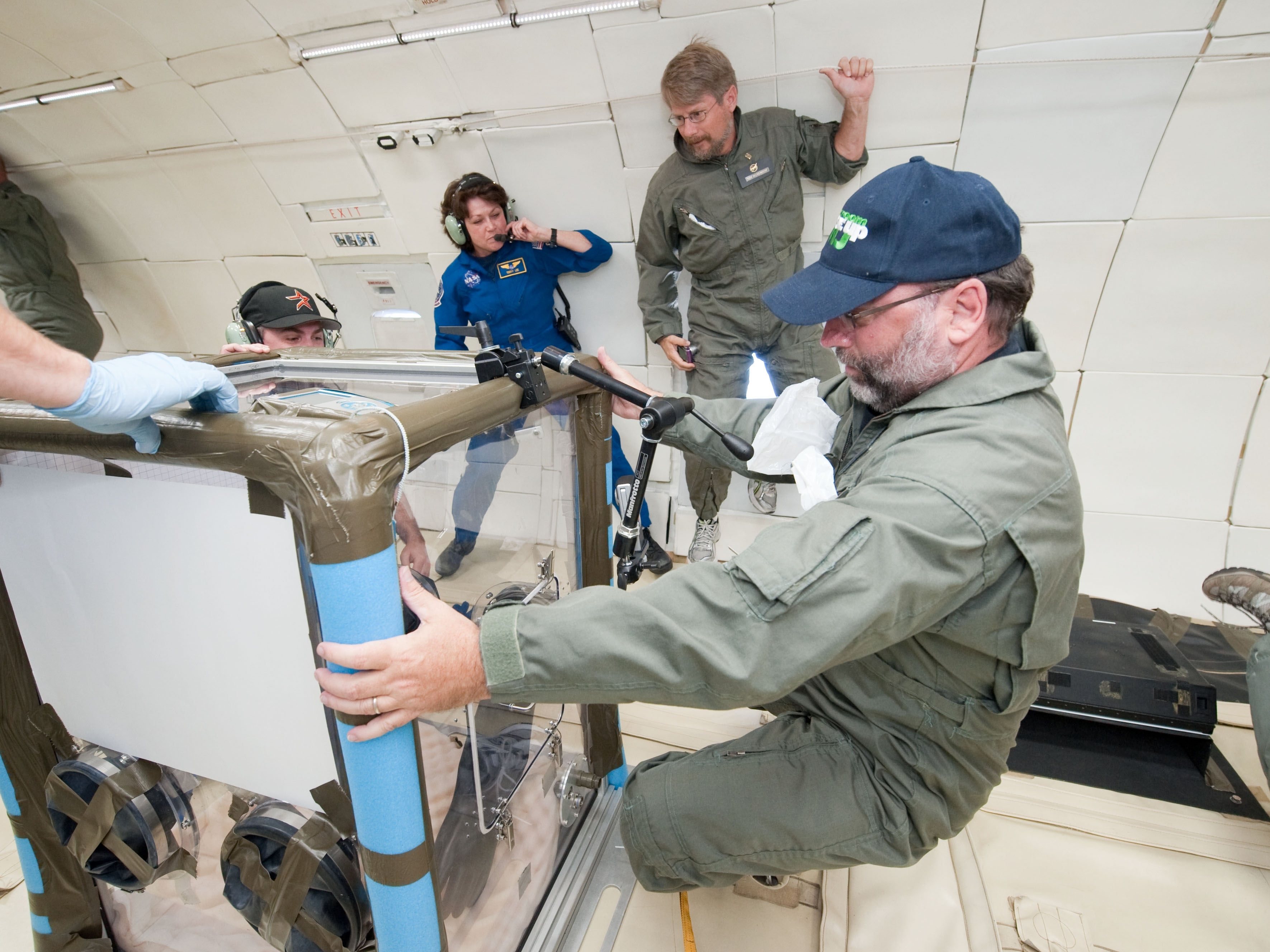 John Moore maneuvers a CubeSat onboard a NASA zero-gravity aircraft