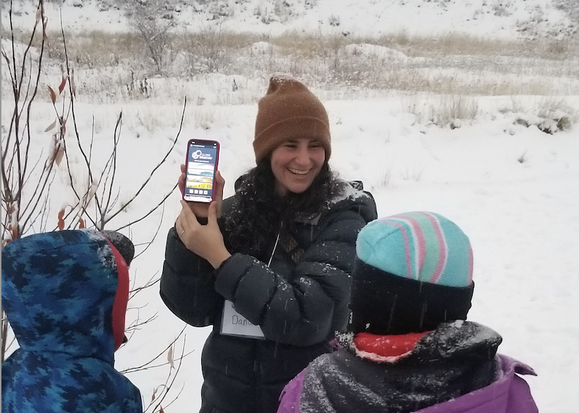 Students being shown how to use the Landcover app to measure river ice. Photo by Chris Arp.