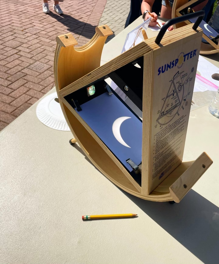 a "Sunspotter" helps participants view the eclipse
