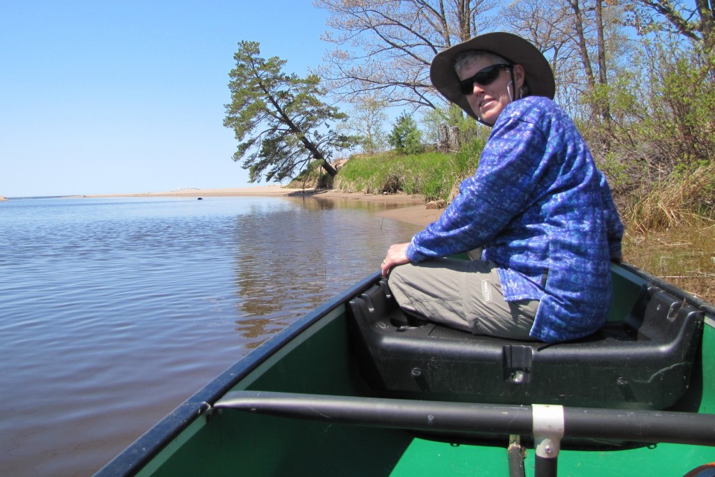 Kate Crowley sits in a boat on Lake Superior. Photo Courtesy of Mike Link.