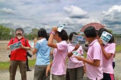 Students looking at clouds.
