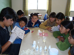 children huddled around table