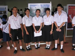 Students posing with a poster. 