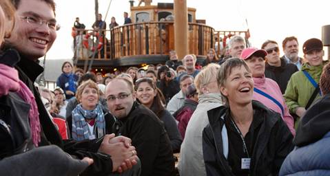 People smiling in a crowd