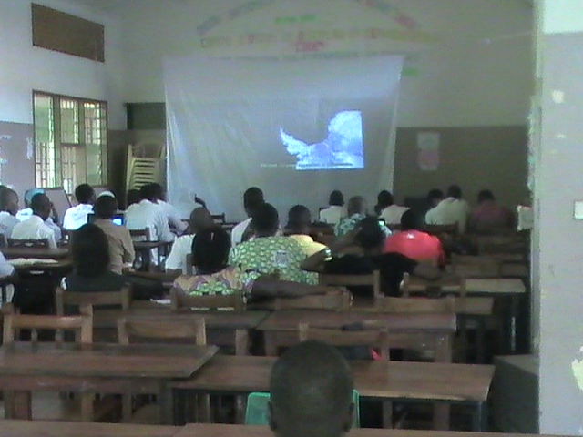 students in africa watching presentation