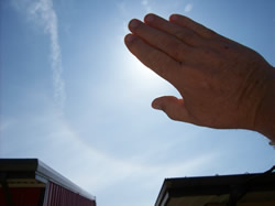 hand blocking sun