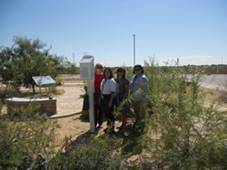 Group of students with weather device.