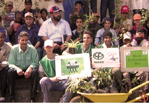 Volunteers with Replant New Orleans plant trees in city devastated by floods