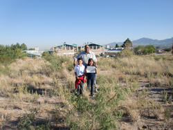 People in grass and desert