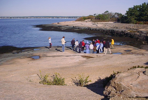 A group of people standing on the Outer Island.
