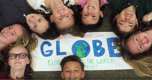 Students laying on the floor for the GLOBE Earth Day video challenge.