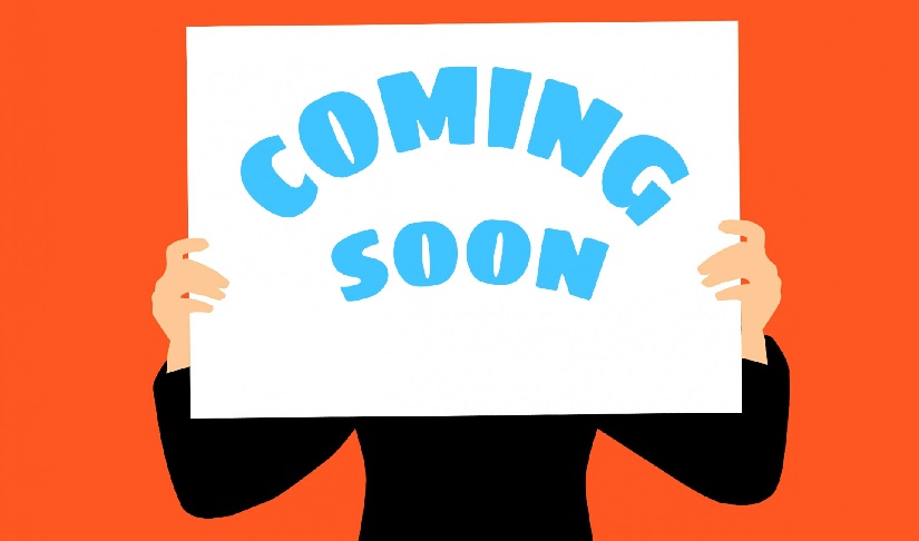 An illustration of a person holding a "Coming Soon" sign.