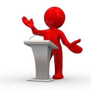Graphic of a person up at a podium, giving a presentation.