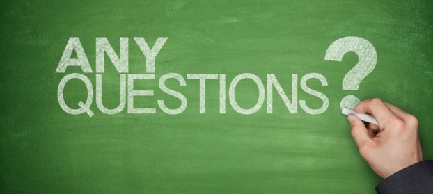Graphic of chalk on a chalkboard that reads, "Any Questions?"