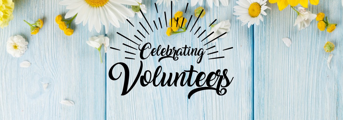 A photo of a sign that reads "Celebrating Volunteers"