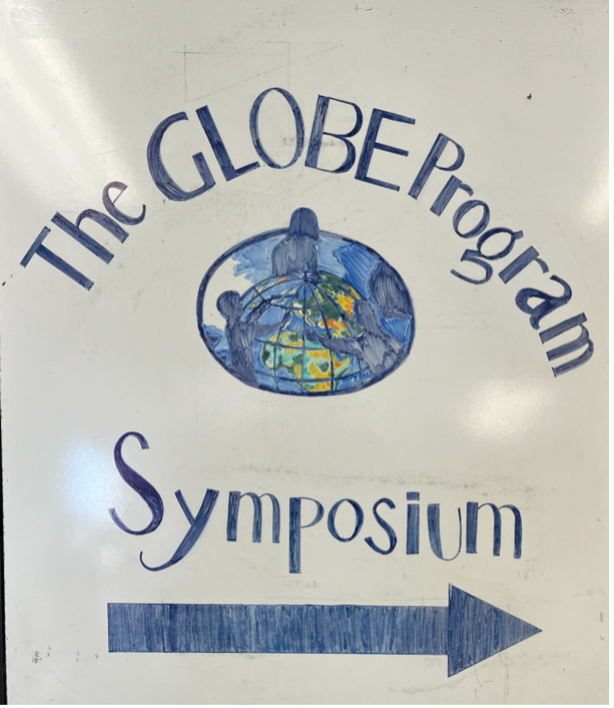 A sign welcoming participants to the GLOBE Program Symposium