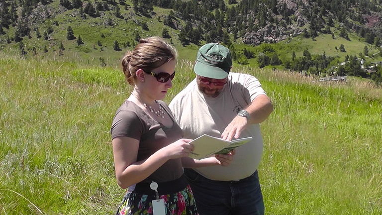 Student Scientist Emily and GPO Staff Member Gary discussing the MUC classification for their land cover site